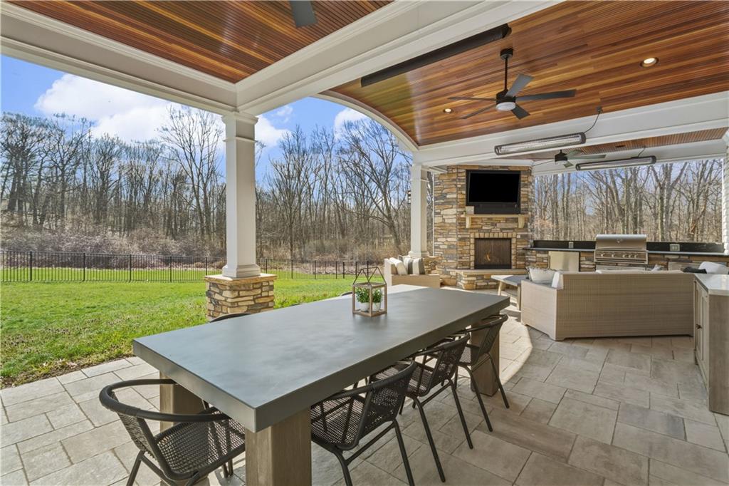 237 Morning Grove Lane Valencia, PA 16059 - Photo 44 of 50 Gas FP with stone veneer, built-in grill and fridge, trash drawer as well.