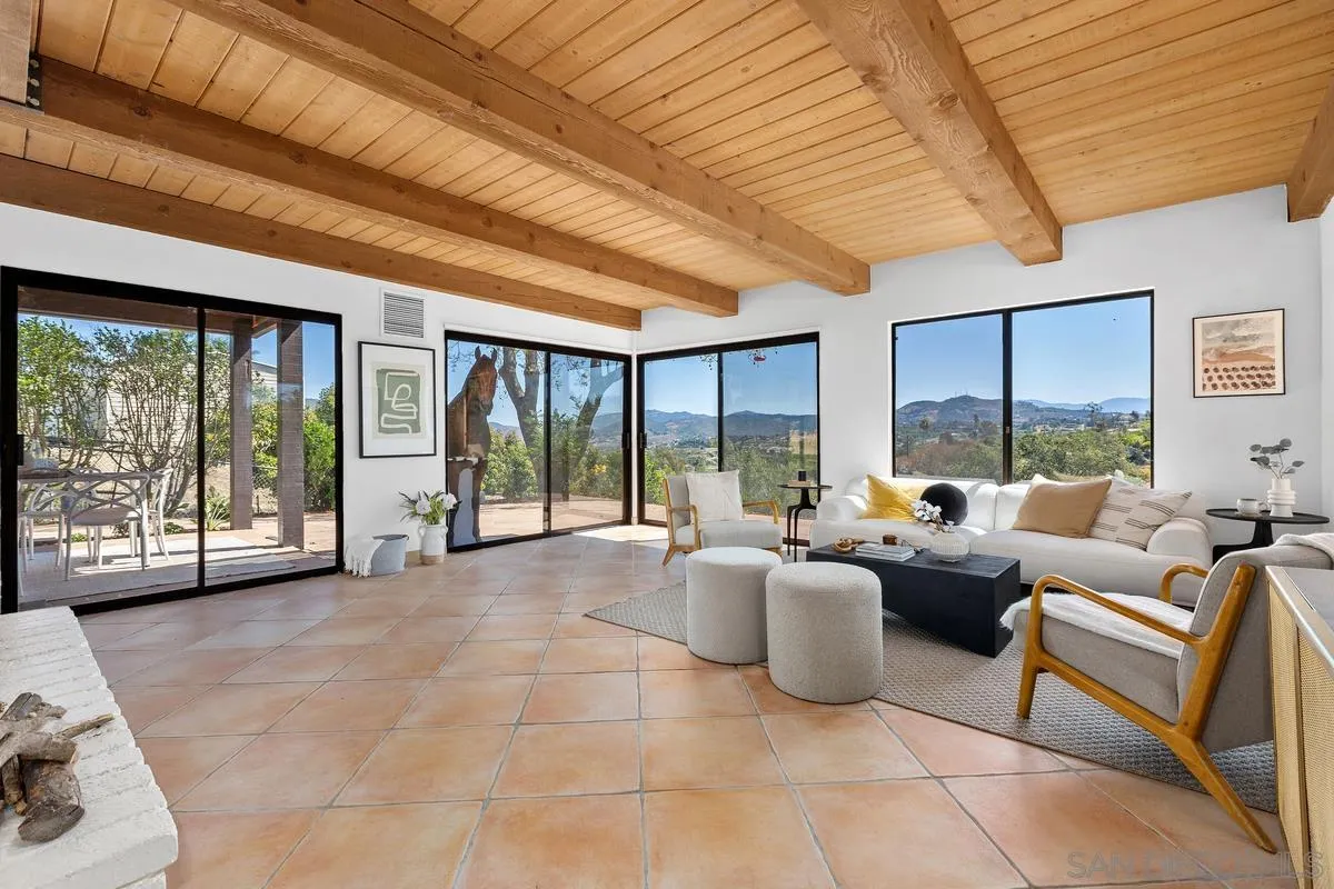 974 Via Hillview Fallbrook, CA 92028 - Photo 2 of 43 a living room with furniture and large windows