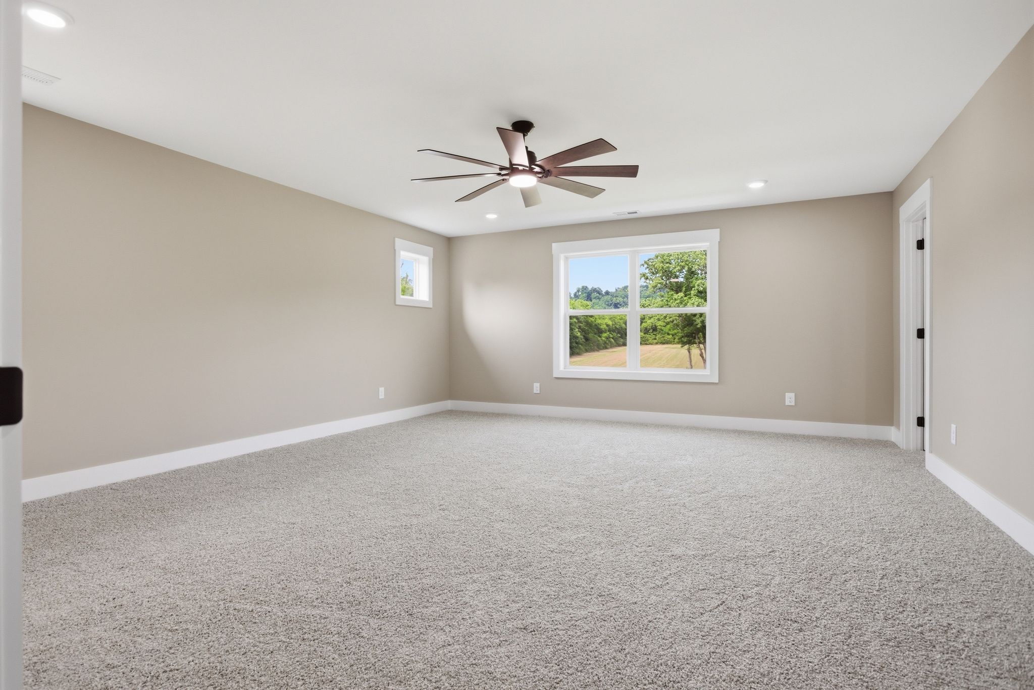 3319 Booker Ridge Road Mount Pleasant, TN 38474 - Photo 29 of 51 an empty room with windows and ceiling fan