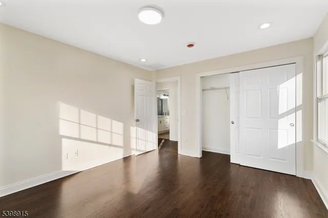 a view of a livingroom with wooden floor