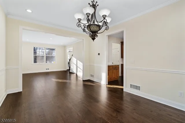 a view of a livingroom with wooden floor