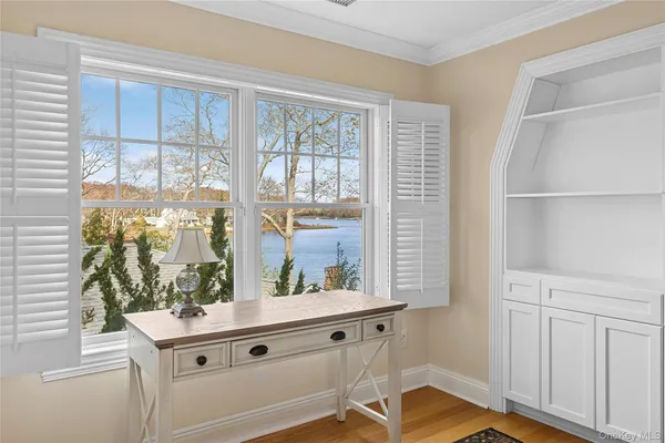 a room with window wooden floor and front door
