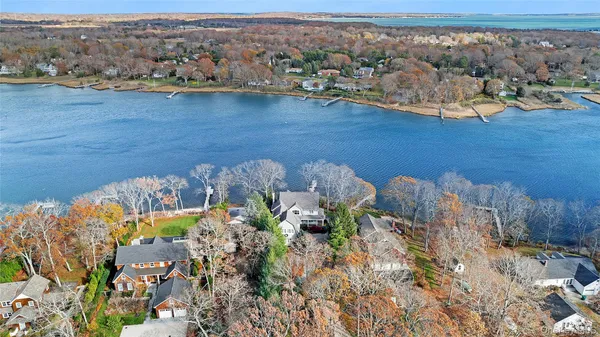 an aerial view of a house with a lake view
