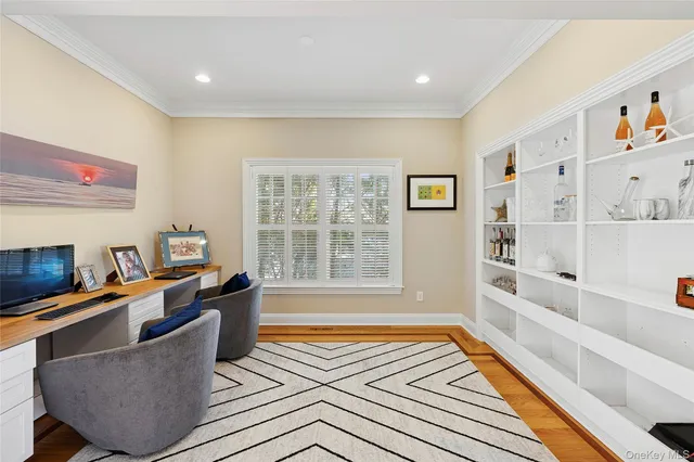 a living room with furniture fireplace and a window