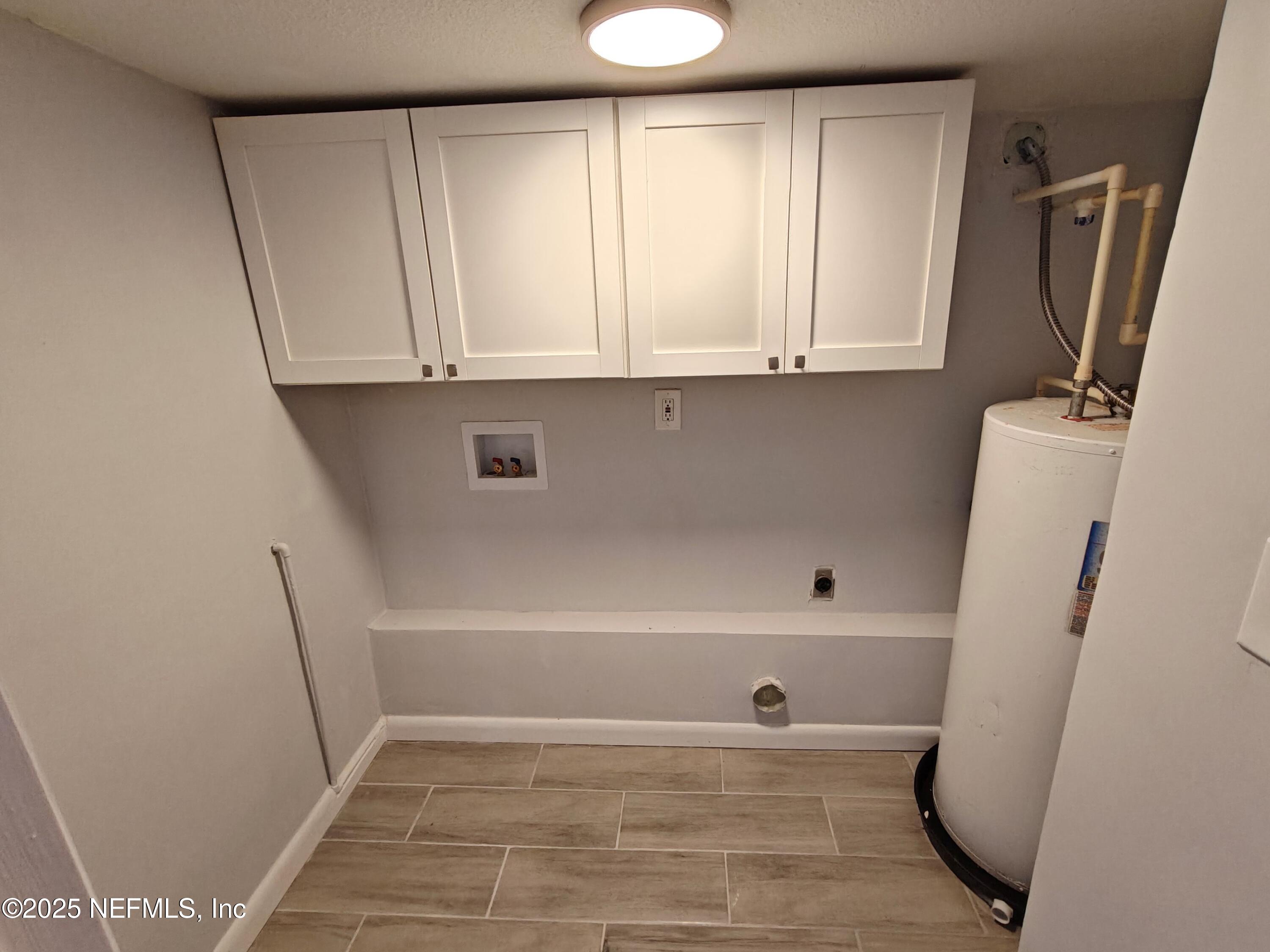 2921 Mansion Road Jacksonville, FL 32277 - Photo 21 of 40 a view of kitchen with wooden floor and electronic appliances