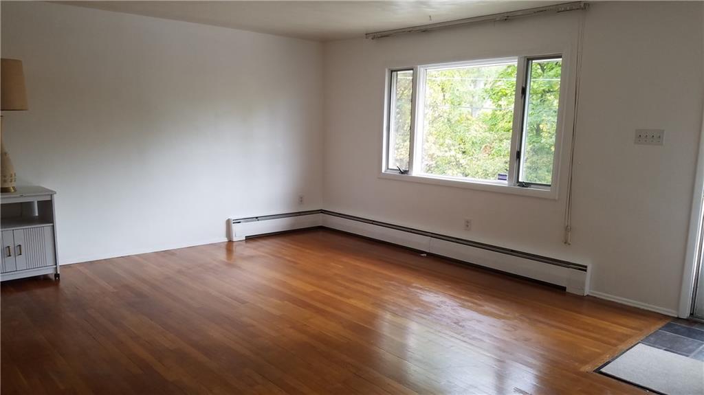 4021 Portman Avenue Pittsburgh, PA 15214 - Photo 2 of 16 Gleaming hardwood floors and freshly painted walls in the homes living room welcome you.