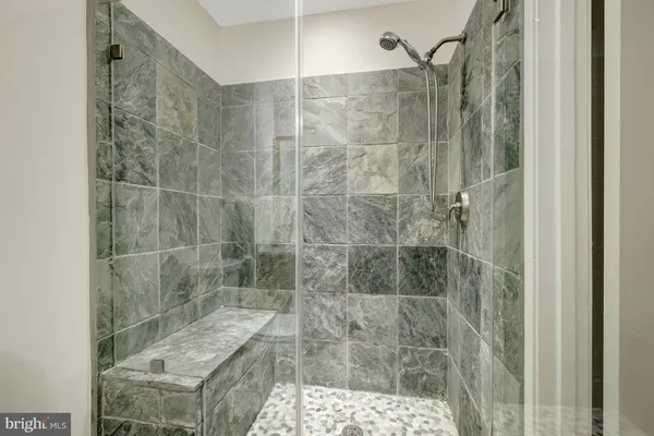 a utility room with cabinets washer and dryer