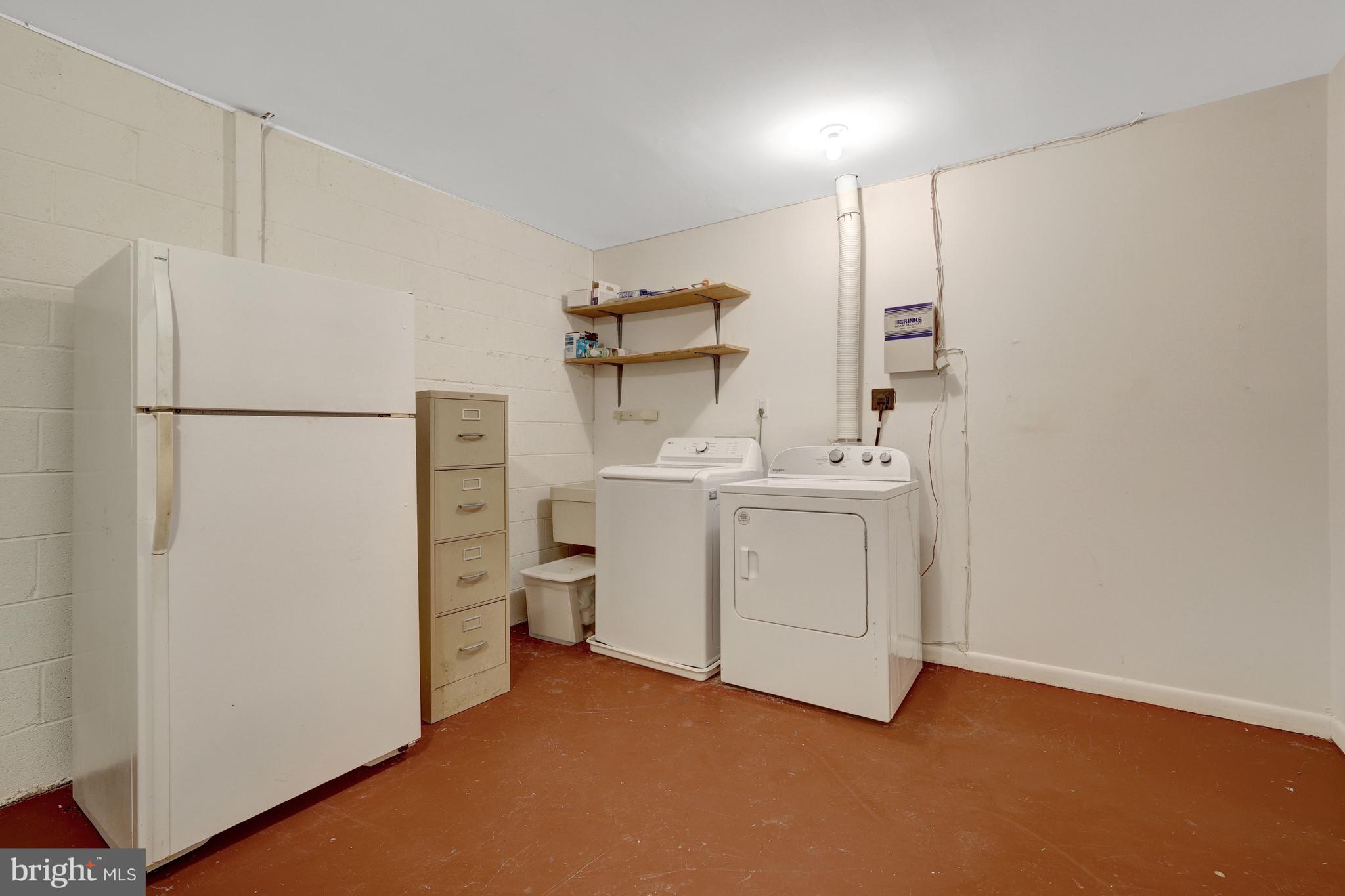 1752 Wainwright Drive Reston, VA 20190 - Photo 44 of 51 Large Laundry/Utility Room with extra frig