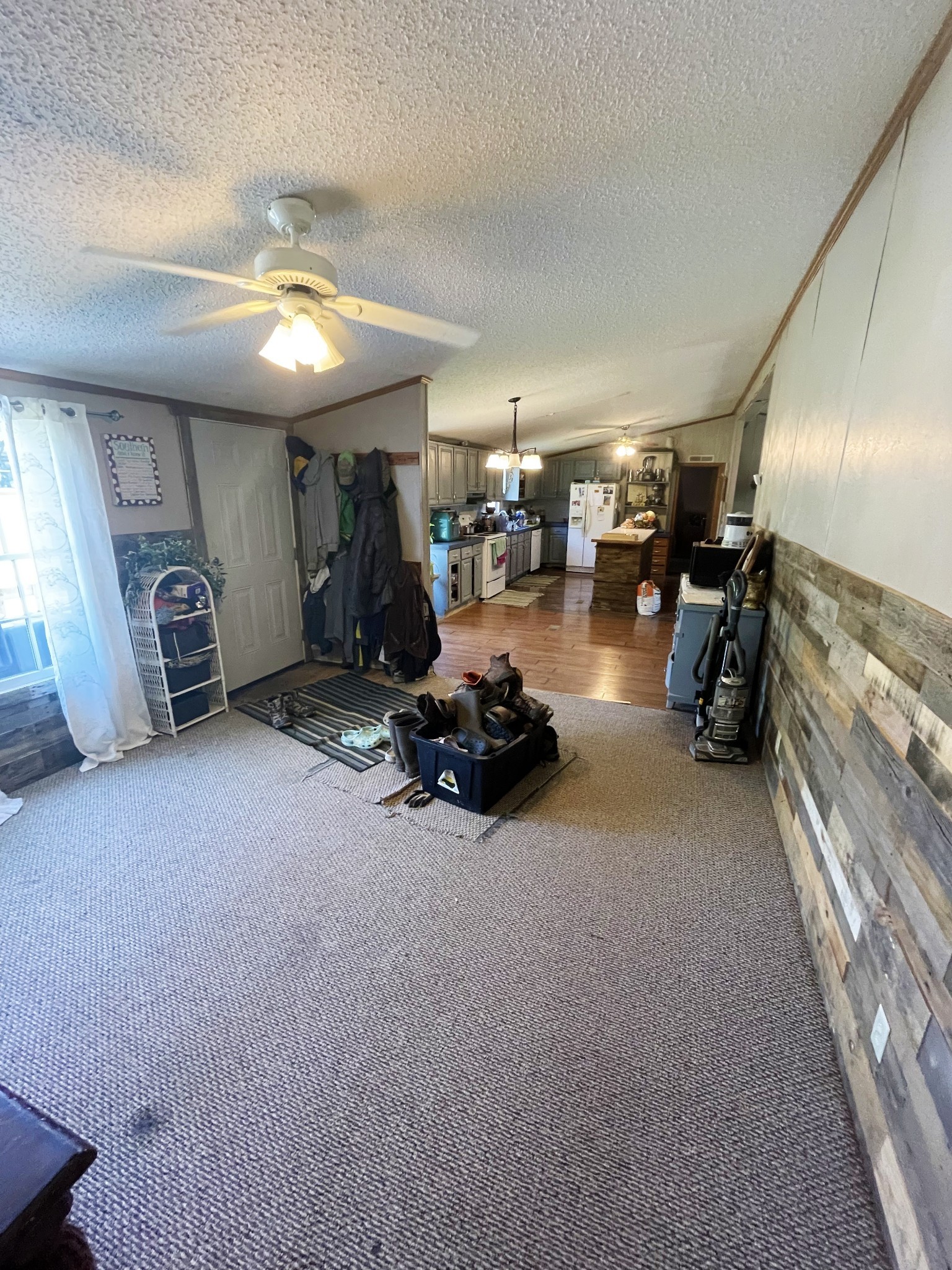 126 Yoder Lane Summertown, TN 38483 - Photo 12 of 69 a view of a livingroom with furniture and a ceiling fan