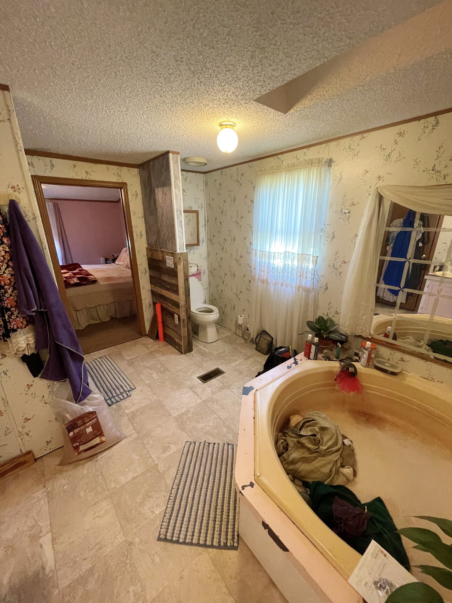 126 Yoder Lane Summertown, TN 38483 - Photo 19 of 69 a bedroom with bed and a couch