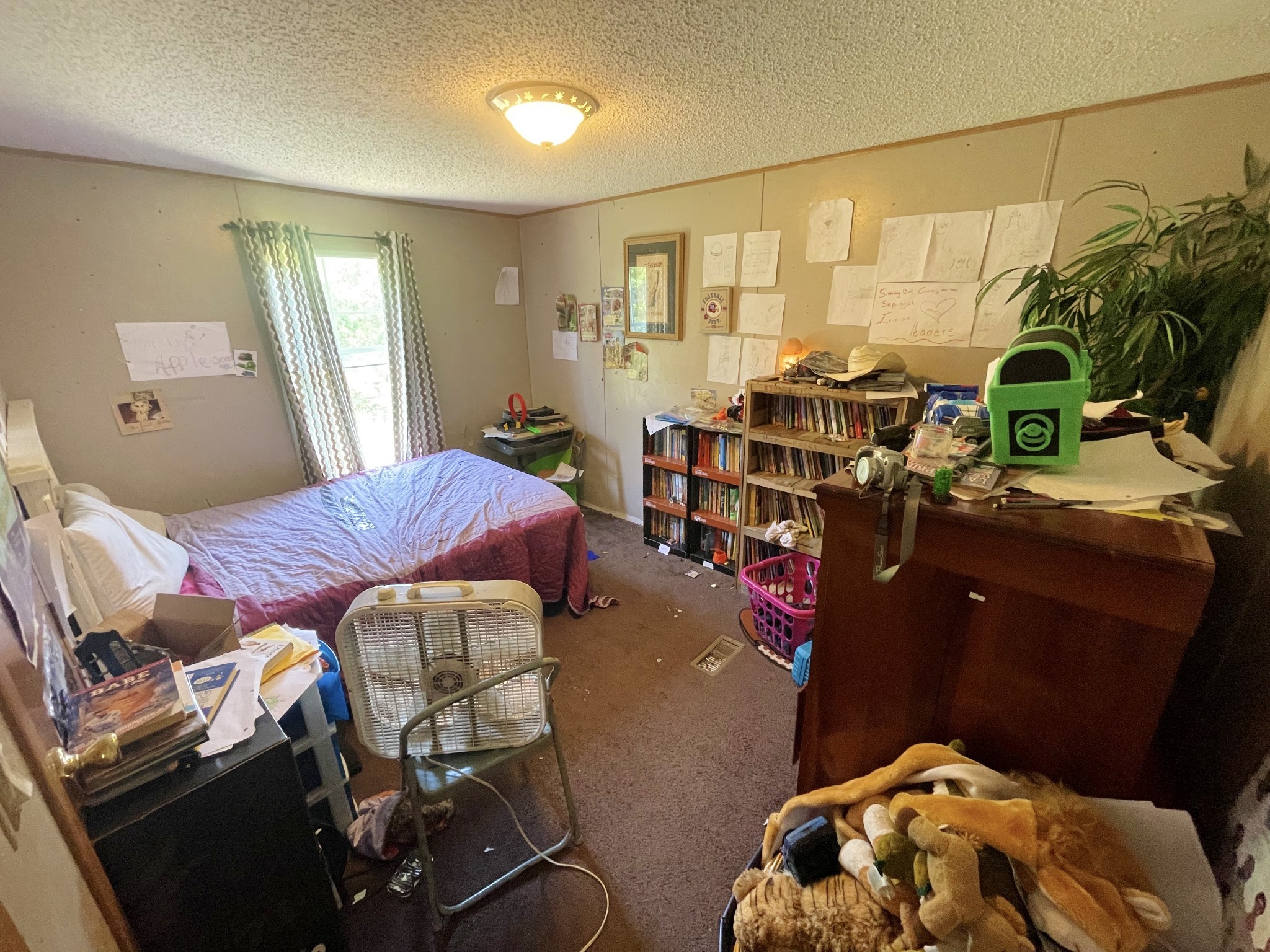 126 Yoder Lane Summertown, TN 38483 - Photo 25 of 69 a bed room with a bed and a chair