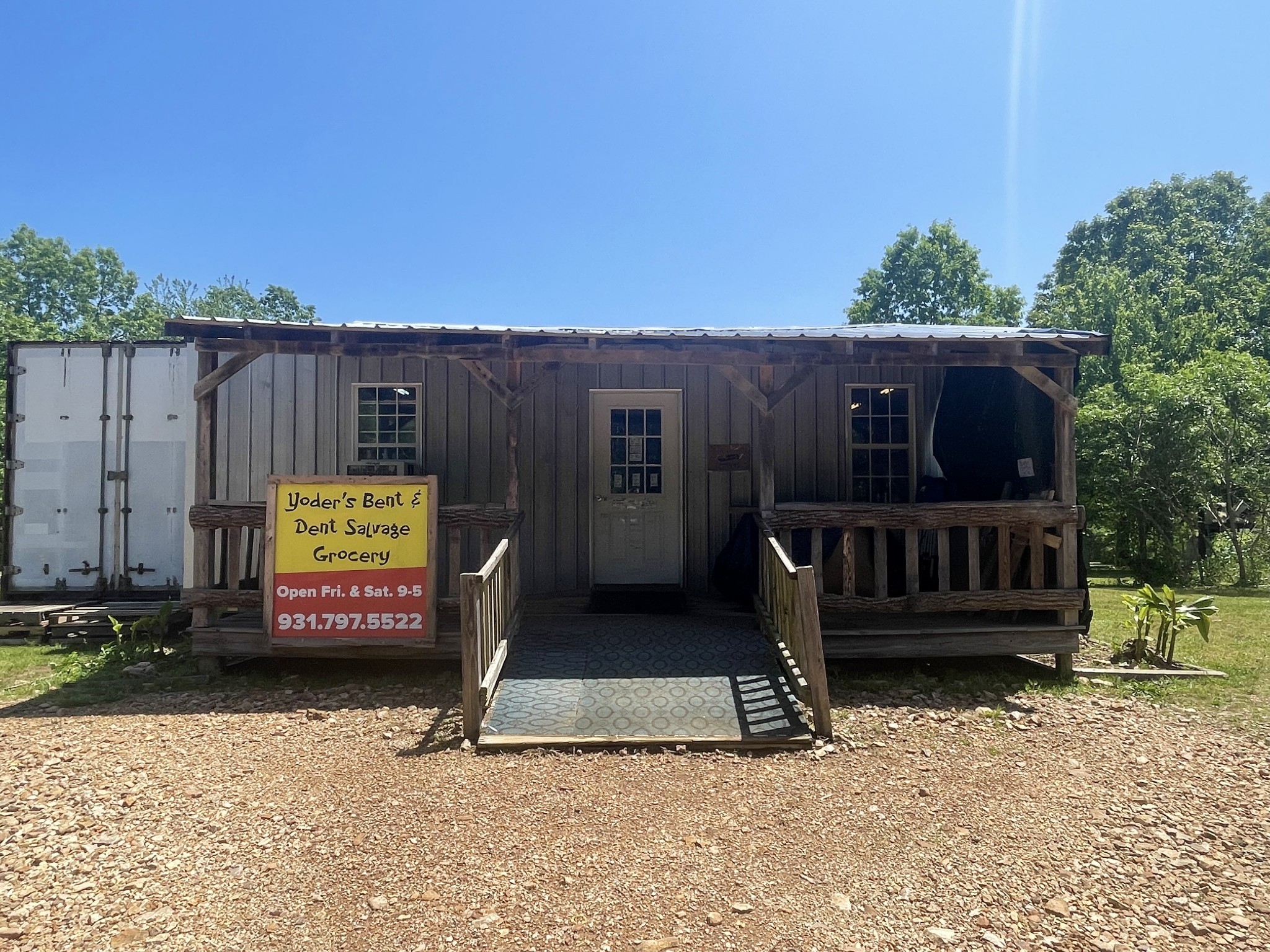 126 Yoder Lane Summertown, TN 38483 - Photo 35 of 69 a view of a house with wooden fence next to a yard