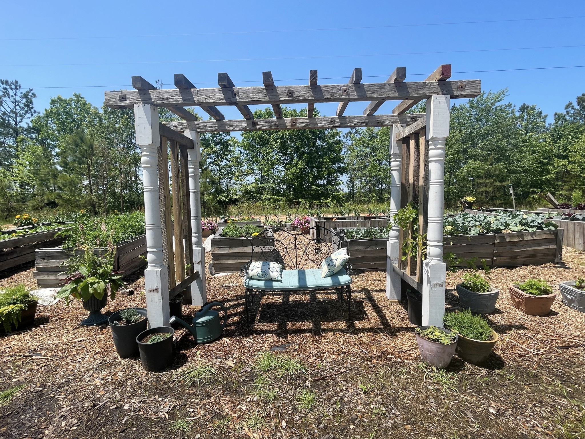 126 Yoder Lane Summertown, TN 38483 - Photo 4 of 69 a view of a patio with table and chairs potted plants with wooden floor and fence