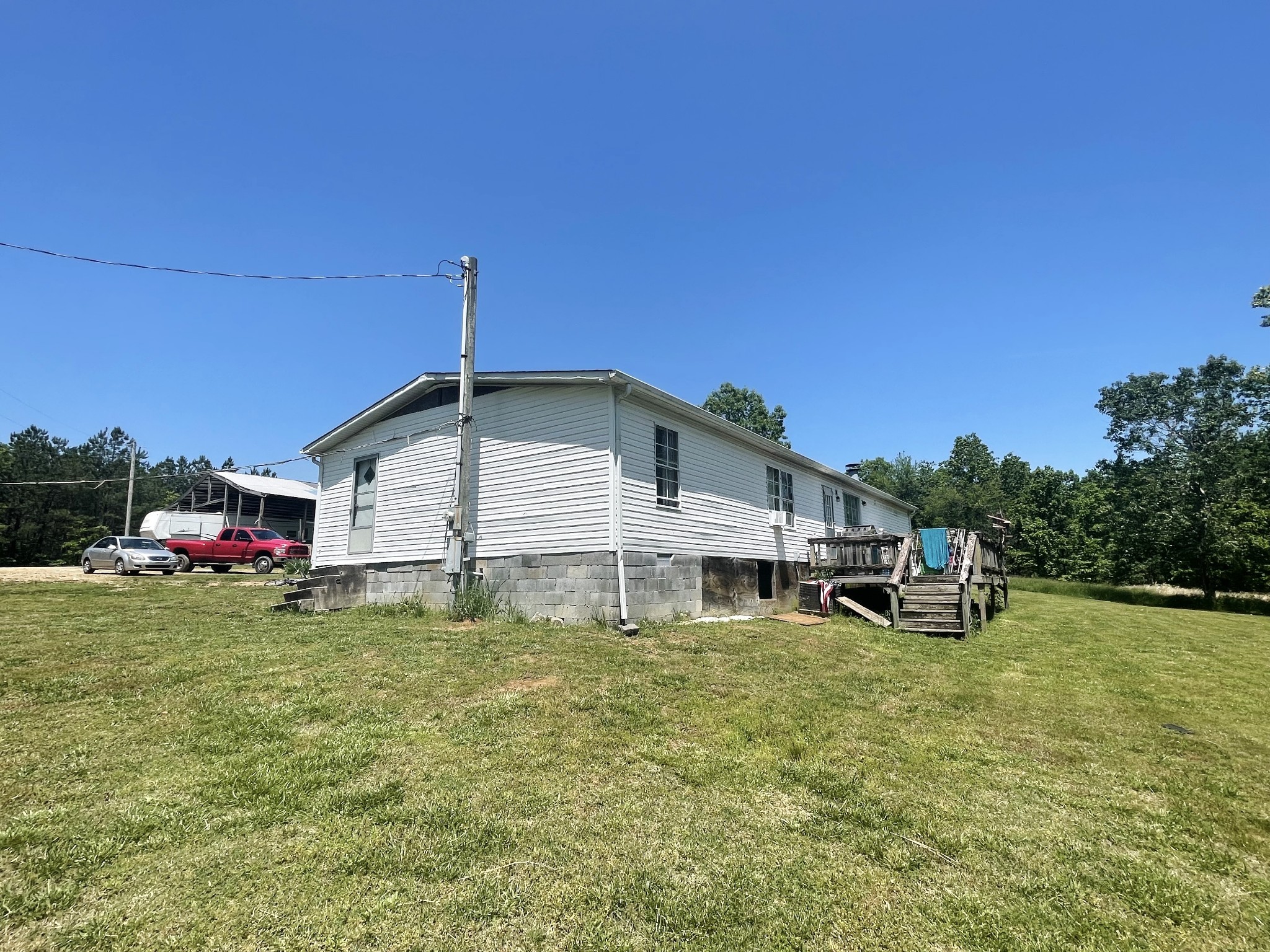 126 Yoder Lane Summertown, TN 38483 - Photo 10 of 69 a view of a house with backyard porch and sitting area
