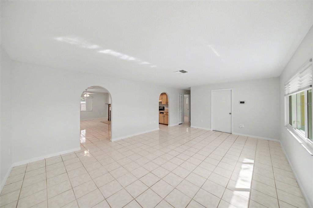 113 Ruskin Avenue Spring Hill, FL 34606 - Photo 7 of 32 an empty room with windows