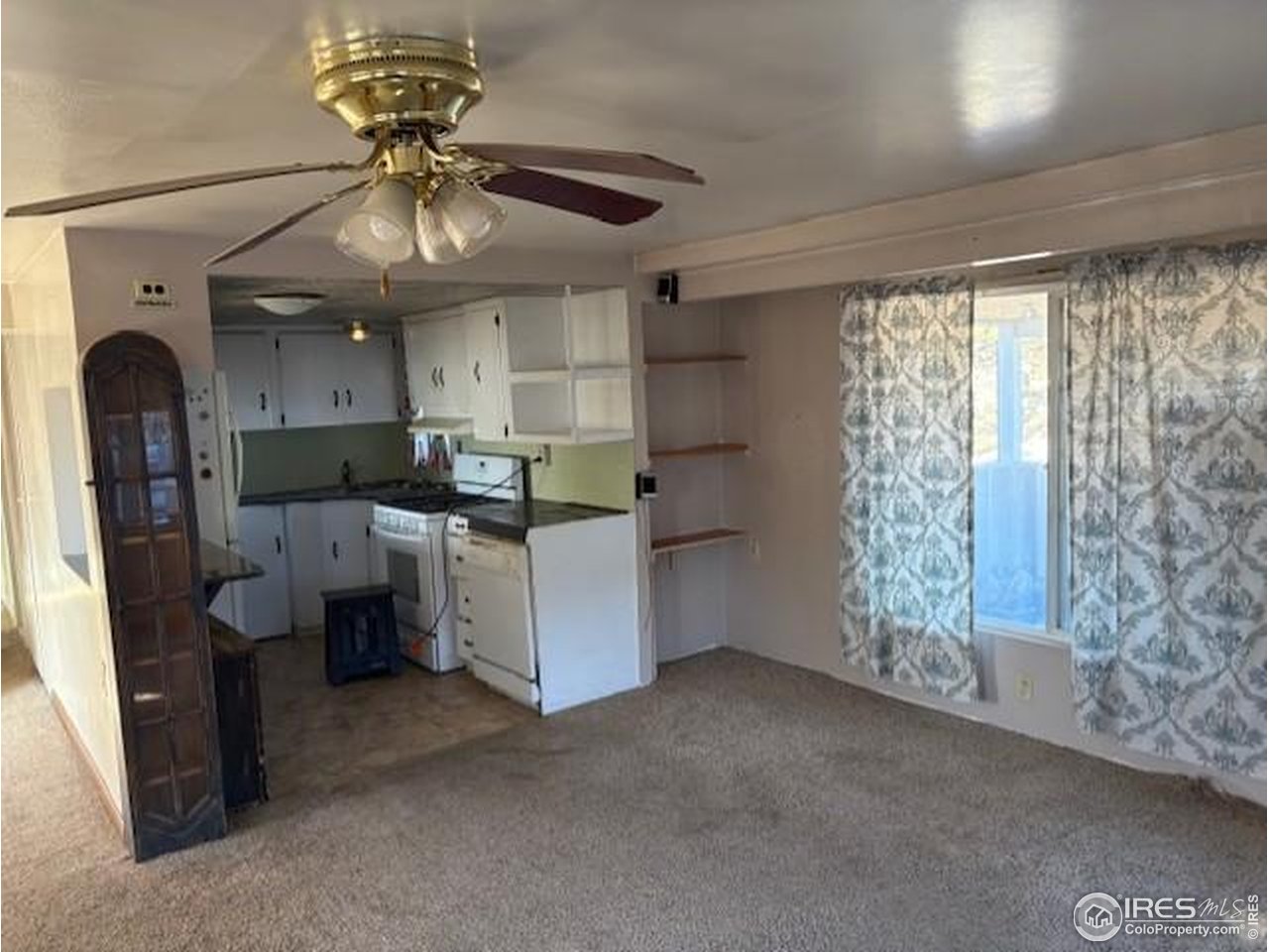 3312 Burns Street Laporte, CO 80535 - Photo 3 of 12 a kitchen with refrigerator and window