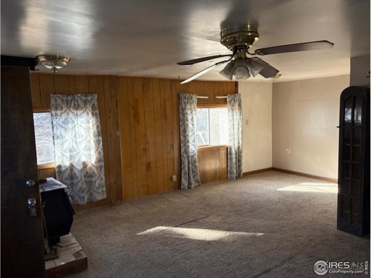 3312 Burns Street Laporte, CO 80535 - Photo 5 of 12 a view of a livingroom with a ceiling fan and window