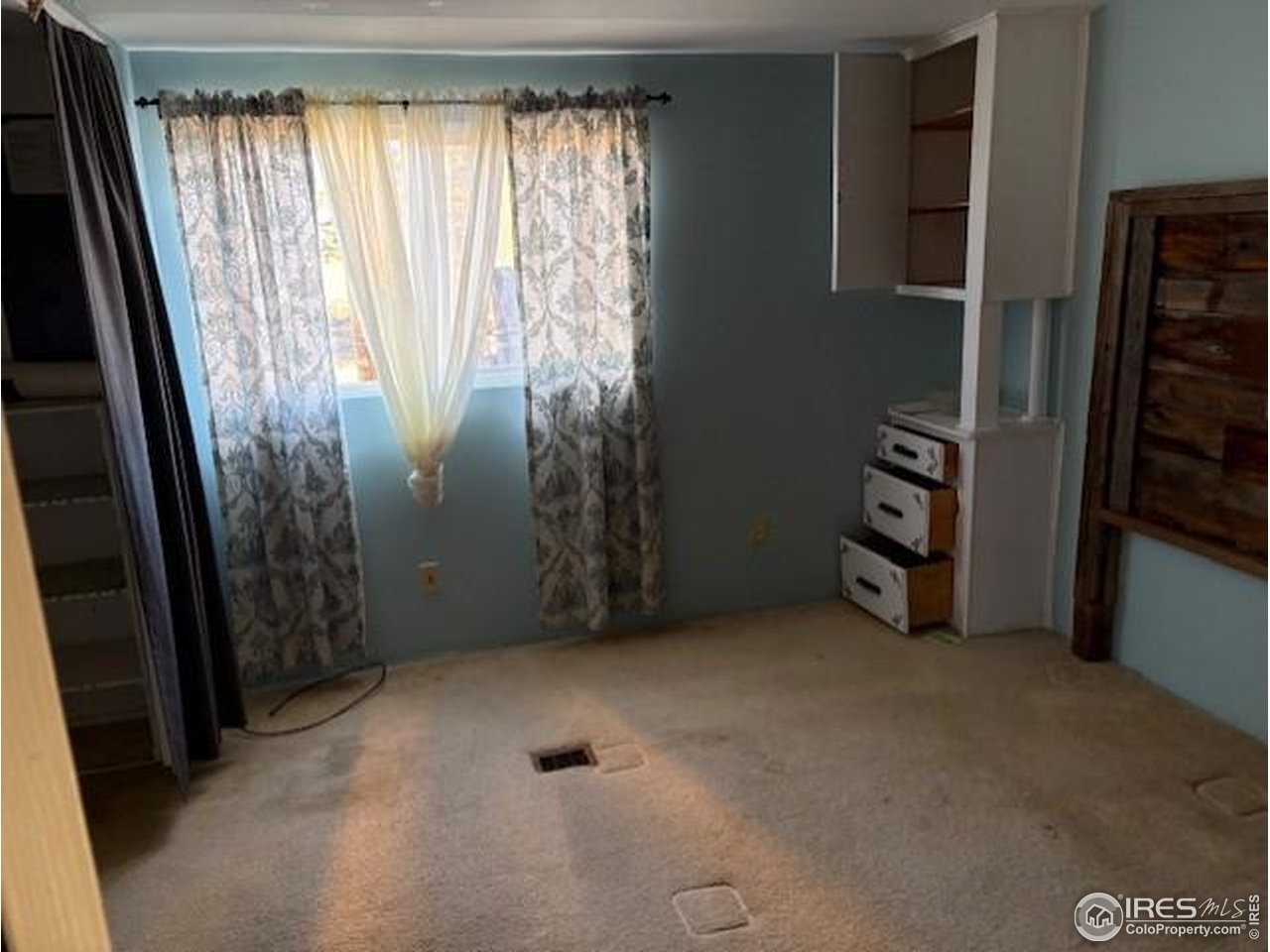 3312 Burns Street Laporte, CO 80535 - Photo 7 of 12 an empty room with windows and a fan