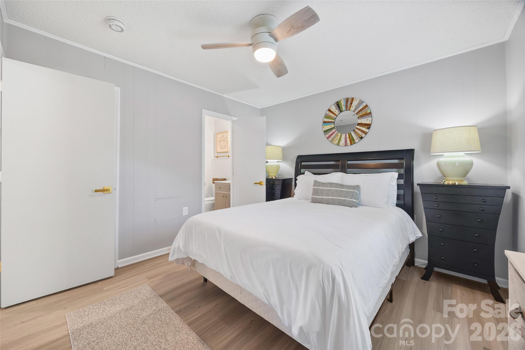 5280 Masons Ferry Road Clover, SC 29710 - Photo 21 of 45 a bedroom with a bed and a chandelier