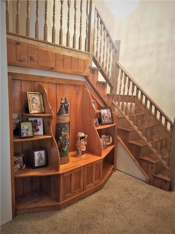 122 Cubbage Lane Butler, PA 16001 - Photo 14 of 25 Beautiful custom wood cabinet at entry way going upstairs to other bedrooms.