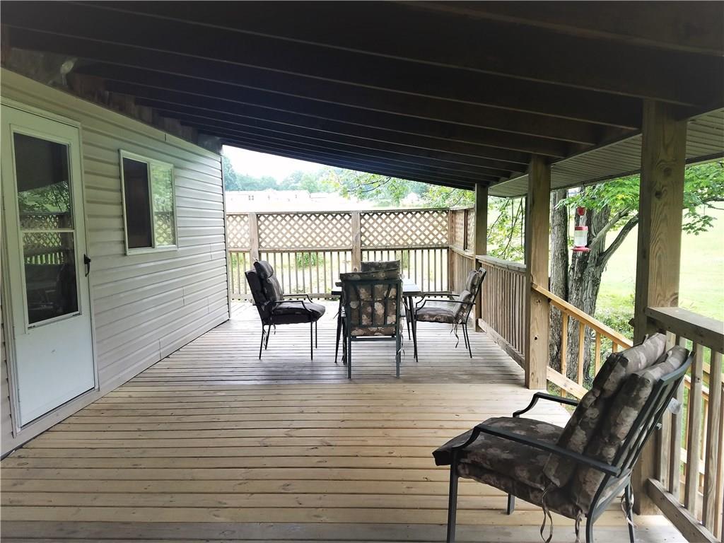 122 Cubbage Lane Butler, PA 16001 - Photo 19 of 25 Extremely large covered deck off the back of the house. Walk out from the kitchen and living room for some great morning coffee or evening dinner. Great for entertaining.
