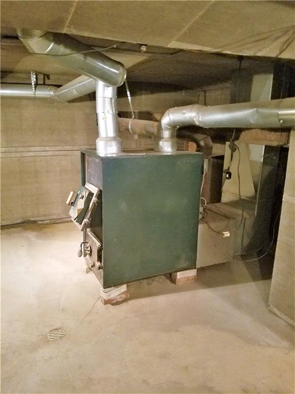 122 Cubbage Lane Butler, PA 16001 - Photo 22 of 25 This house has 2 sources for heat. Oil or this large wood burning furnace.
