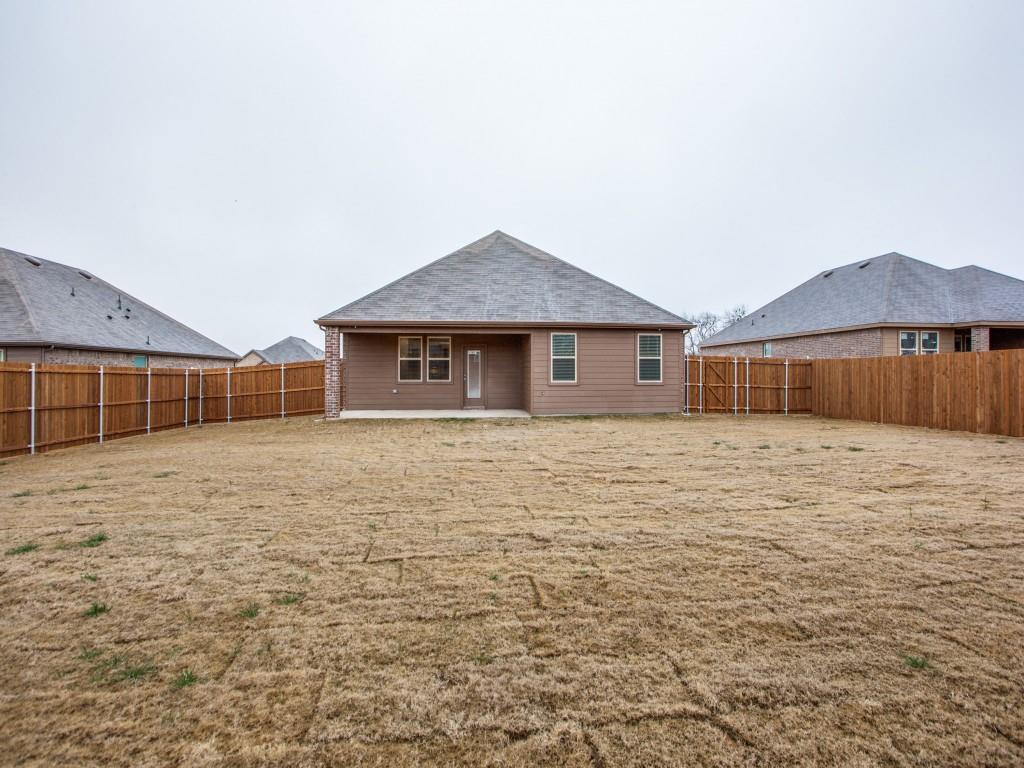 123 Lakeview Circle Pilot Point, TX 76258 - Photo 36 of 39 a house with yard in front of it