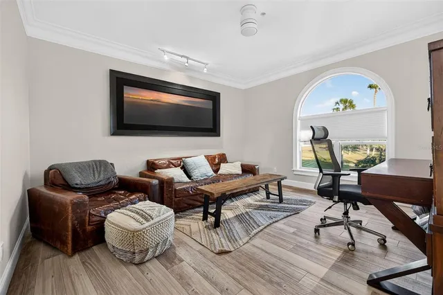 a living room with a sink tub and mirror
