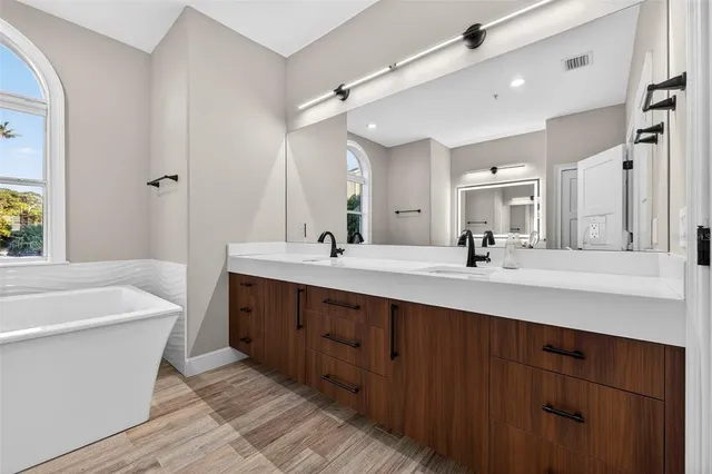 a view of a patio with dining table and chairs