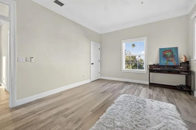 a kitchen with kitchen island granite countertop a sink and cabinets