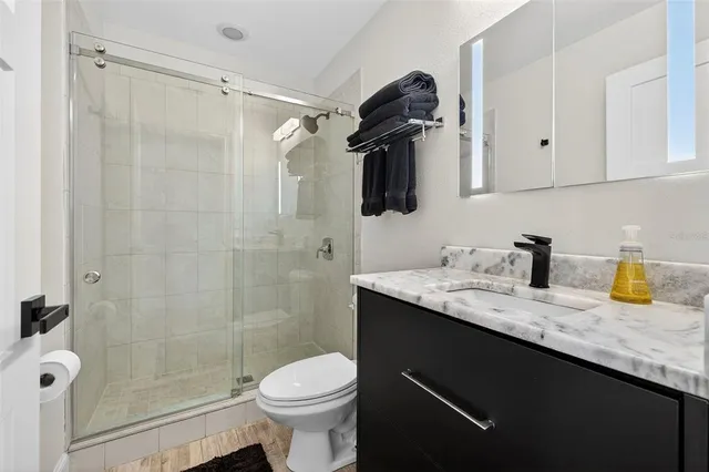 a room with furniture pool table and window