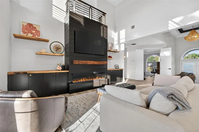 a kitchen with stainless steel appliances kitchen island granite countertop a stove and a sink