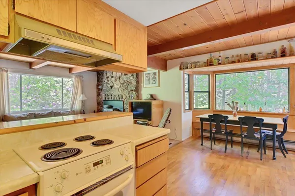 a kitchen with a stove and a refrigerator
