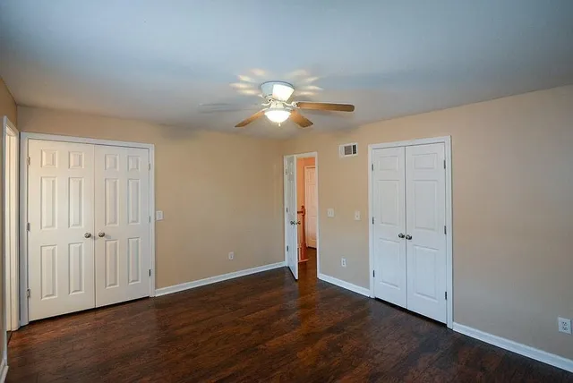 a bathroom with a sink a toilet and a window