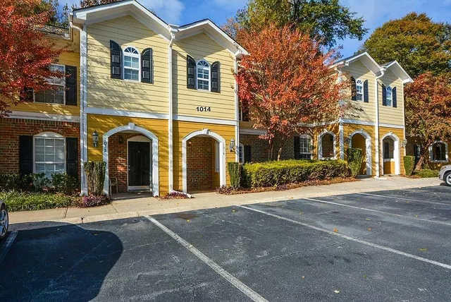 a front view of a house with yard