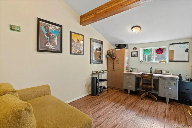 a bedroom with a workspace