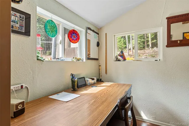 a room with a table and a window