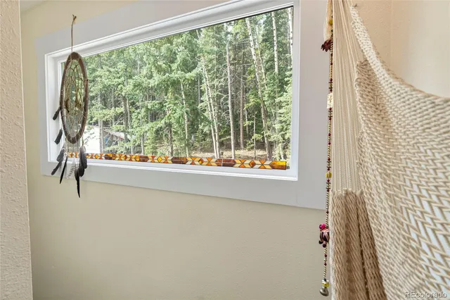 a view of a room with a large window