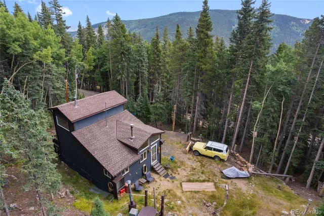 a view of a wooden deck and a backyard