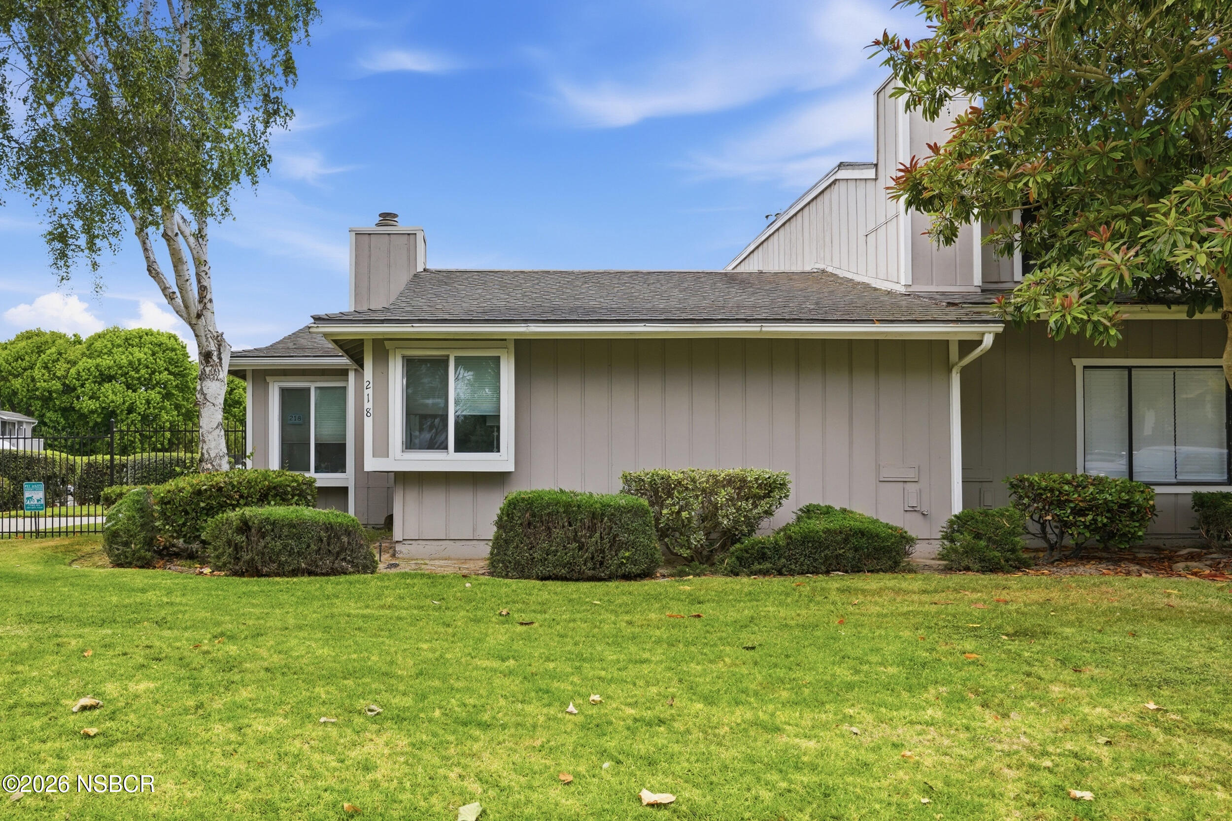 218 North R Street Lompoc, CA 93436 - Photo 5 of 24 a front view of a house with garden