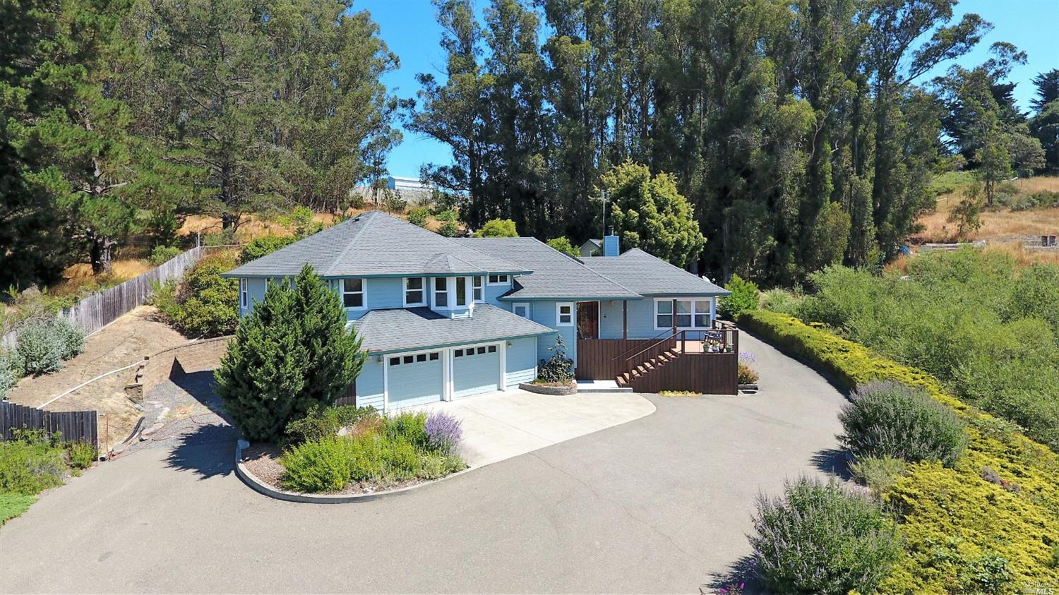 2567 Blucher Valley Road Sebastopol, CA 95472 - Photo 1 of 1 a front view of a house with a yard and lake view