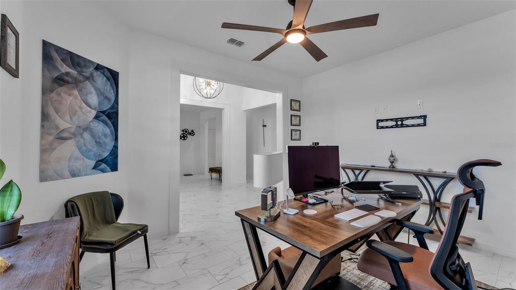 1029 Bergamot Drive Bartow, FL 33830 - Photo 11 of 62 a view of a workspace with furniture and a potted plant