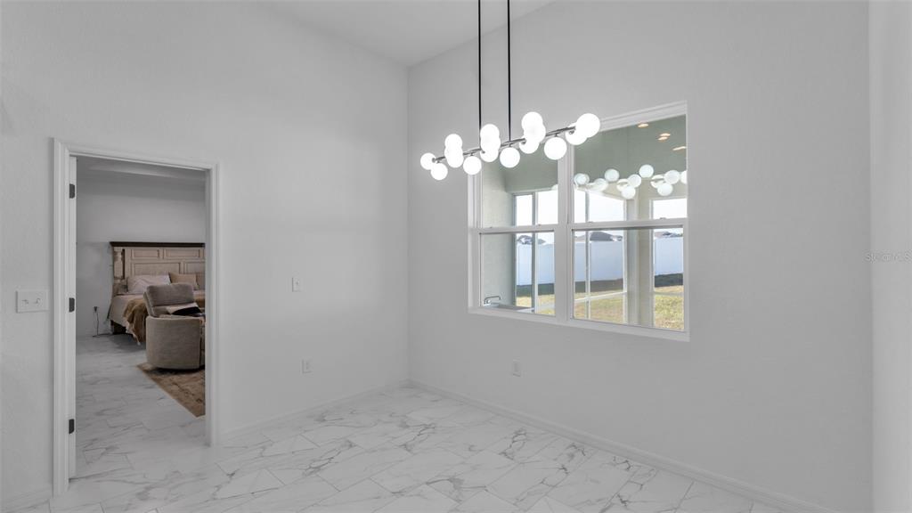 1029 Bergamot Drive Bartow, FL 33830 - Photo 22 of 62 a view of a room with a chandelier