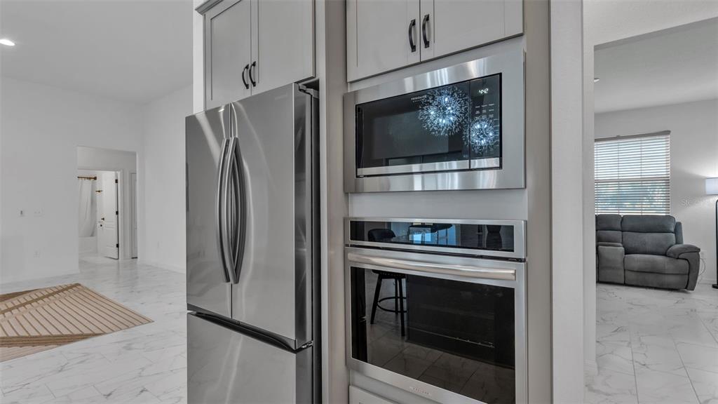 1029 Bergamot Drive Bartow, FL 33830 - Photo 27 of 62 a kitchen with a refrigerator stove and washer