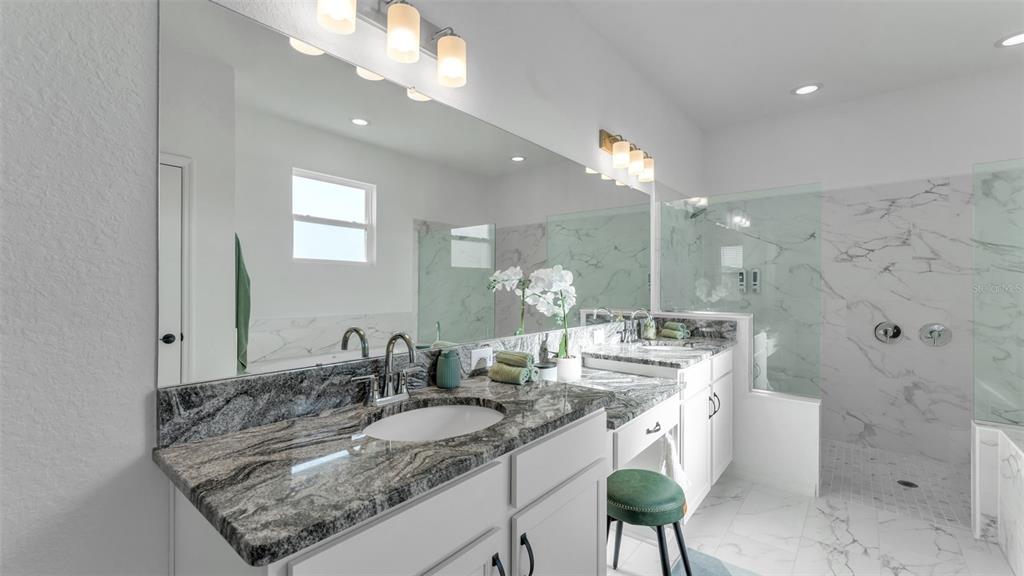 1029 Bergamot Drive Bartow, FL 33830 - Photo 32 of 62 a bathroom with a sink double vanity and a mirror