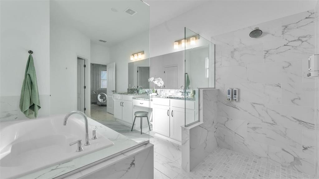 1029 Bergamot Drive Bartow, FL 33830 - Photo 34 of 62 a bathroom with a double vanity sink mirror and shower