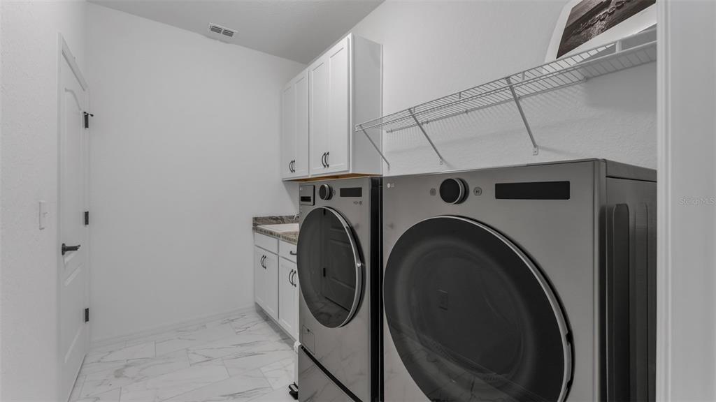 1029 Bergamot Drive Bartow, FL 33830 - Photo 50 of 62 a utility room with dryer and washer