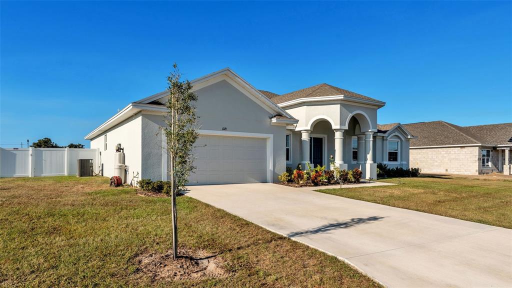 1029 Bergamot Drive Bartow, FL 33830 - Photo 56 of 62 a front view of a house with a yard