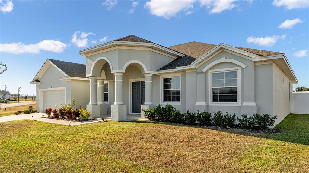 1029 Bergamot Drive Bartow, FL 33830 - Photo 57 of 62 a front view of a house with a yard