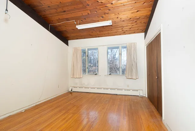 a bathroom with a sink toilet and a mirror